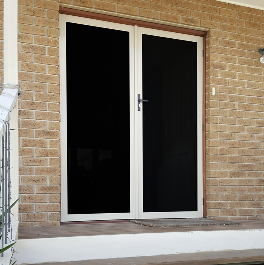 Mainstay Privacy Mesh installed in a door on the porch of a house.